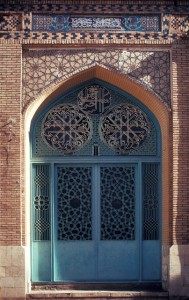 Friday Mosque of Shiraz, Iran Courtyard detail, metal doorway and tiled brick archway, north wing